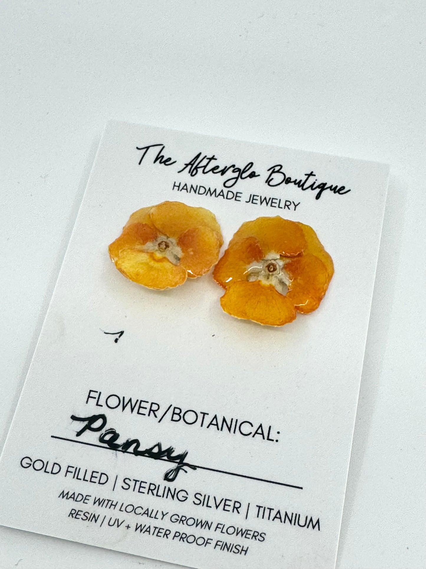 GENUINE ORANGE PANSY STUDS